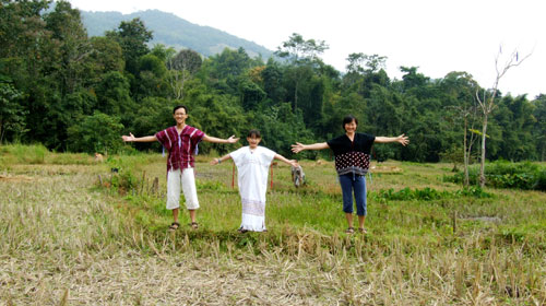 The Yongs at rice paddy of Tigerland Rice Farm